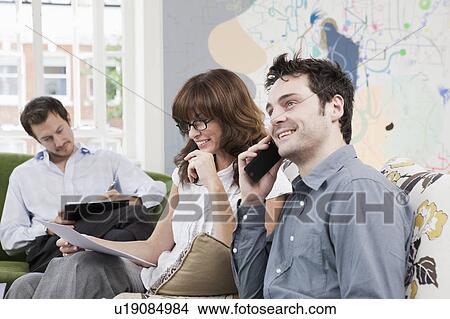 People working at casual office View Large Photo Image Picture - People working at casual office. Fotosearch