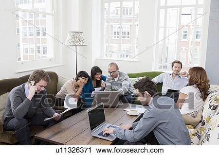 Stock Image - People working at casual office. Fotosearch