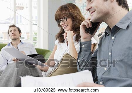 People working at casual office View Large Photo Image Stock Image - People working at casual office. Fotosearch