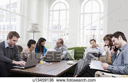 People working at casual office View Large Photo Image Stock Photograph - People working at casual office. Fotosearch