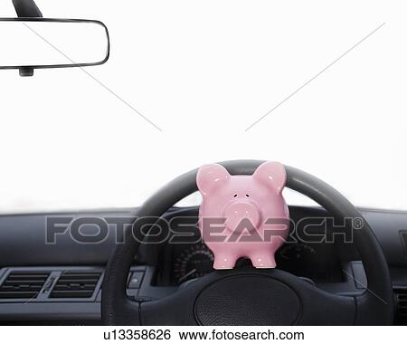 Piggy bank on dashboard View Large Photo Image Stock Photograph - Piggy bank on dashboard. Fotosearch