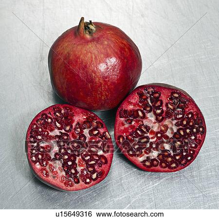 Pomegranates on a steel surface View Large Photo Image Stock Photograph - Pomegranates on a steel surface. Fotosearch