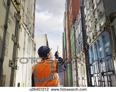 Port Worker With Shipping Containers View Large Photo Image Stock Image - Port Worker With Shipping Containers. Fotosearch