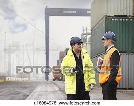 Stock Photo - Port Workers With Containers. Fotosearch