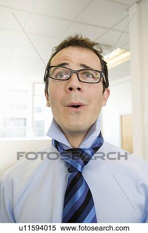 Stock Photography - Portrait of a business man looking up. Fotosearch