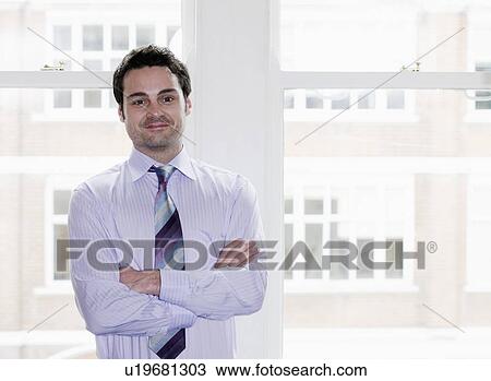 Stock Image - Portrait of a Businessman.. Fotosearch