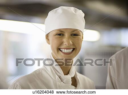 Stock Photo - Portrait of a chef in a kitchen. Fotosearch