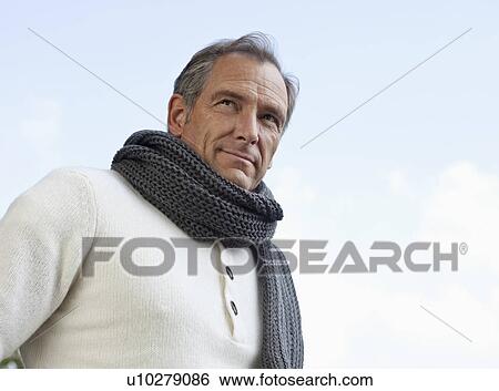 Stock Photograph - Portrait of a confident looking man. Fotosearch