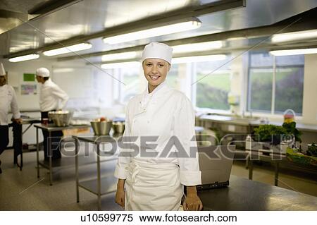 Portrait of a female chef smiling View Large Photo Image Stock Photography - Portrait of a female chef smiling. Fotosearch
