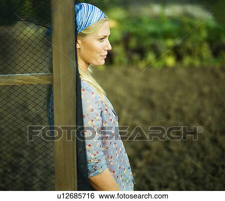 Portrait of a woman in a garden View Large Photo Image Stock Photograph - Portrait of a woman in a garden. Fotosearch