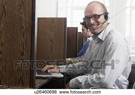 Portrait of call a call center operator View Large Photo Image Stock Photo - Portrait of call a call center operator. Fotosearch