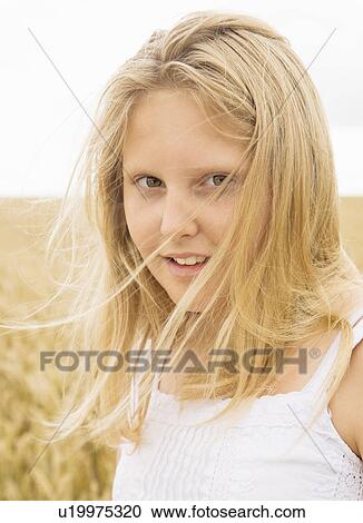 Portrait of girl in corn field View Large Photo Image Stock Image - Portrait of girl in corn field. Fotosearch
