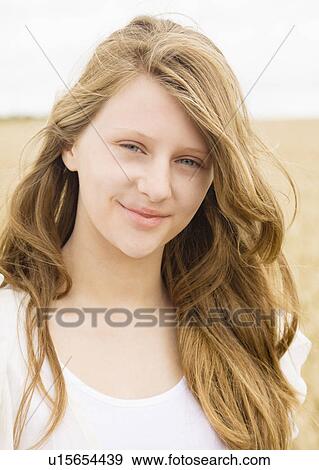 Stock Photo - Portrait of girl in corn field. Fotosearch