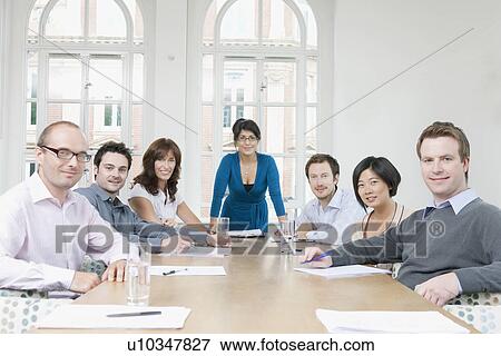 Portrait of group at conference table View Large Photo Image Stock Photo - Portrait of group at conference table. Fotosearch