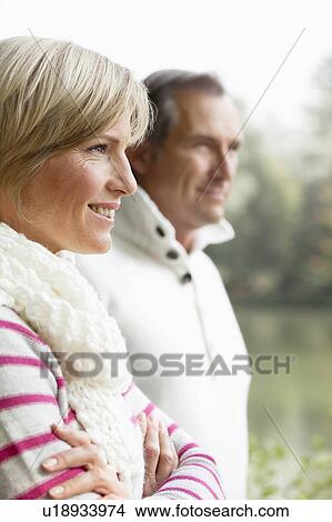 Picture - Portrait of middle aged couple outdoors. Fotosearch