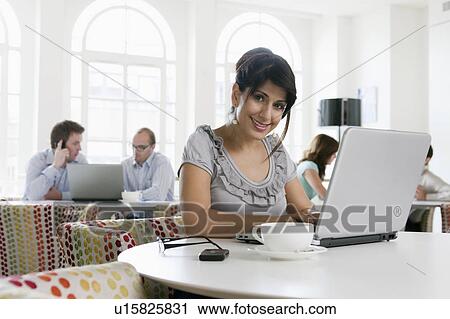 Stock Image - Portrait of women with laptop. Fotosearch