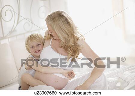 pregnant woman and family View Large Photo Image Stock Image - pregnant woman and family. Fotosearch