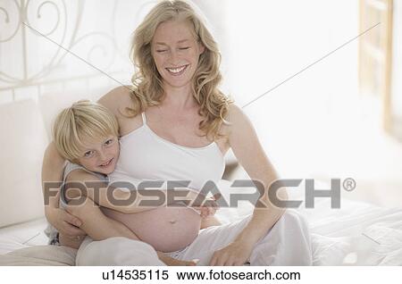 pregnant woman and family View Large Photo Image Stock Photography - pregnant woman and family. Fotosearch