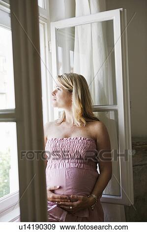 pregnant woman at window View Large Photo Image Stock Photo - pregnant woman at window. Fotosearch