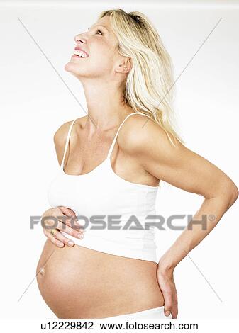Stock Image - Pregnant woman smiling. Fotosearch