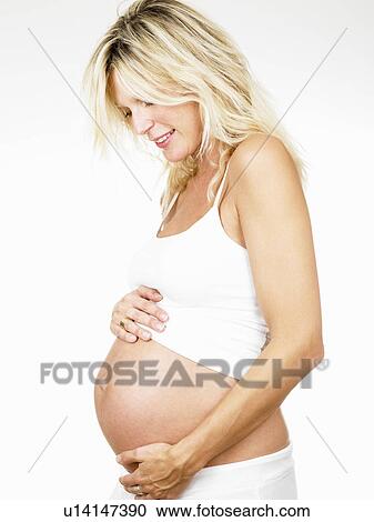 Pregnant woman smiling View Large Photo Image Stock Image - Pregnant woman smiling. Fotosearch