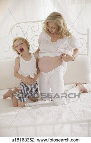 pregnant woman with family View Large Photo Image Stock Image - pregnant woman with family. Fotosearch