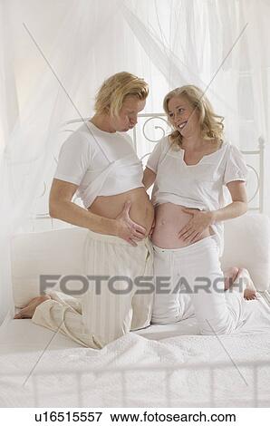 Stock Photo - pregnant woman with family. Fotosearch