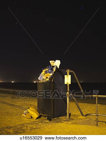 Stock Photo - Public bin at night. Fotosearch