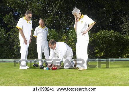 Stock Photography - referee measuring bowls. Fotosearch