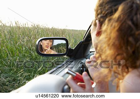 Reflection of woman in rearview mirror View Large Photo Image Stock Image - Reflection of woman in rearview mirror. Fotosearch
