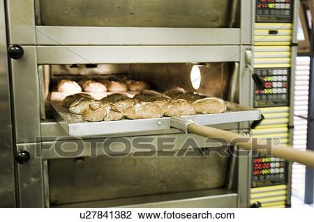 Rolls taken out of an oven View Large Photo Image Stock Image - Rolls taken out of an oven. Fotosearch