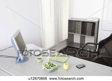 Stock Photograph - salad on desk in office. Fotosearch