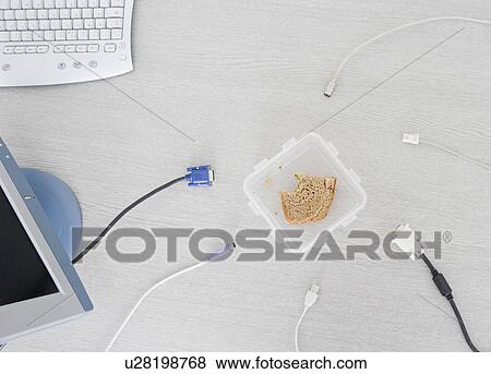 Stock Photo - sandwich box and unplugged cables. Fotosearch