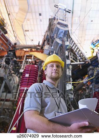 Scientist In Front Of Fusion Reactor View Large Photo Image Stock Photo - Scientist In Front Of Fusion Reactor. Fotosearch