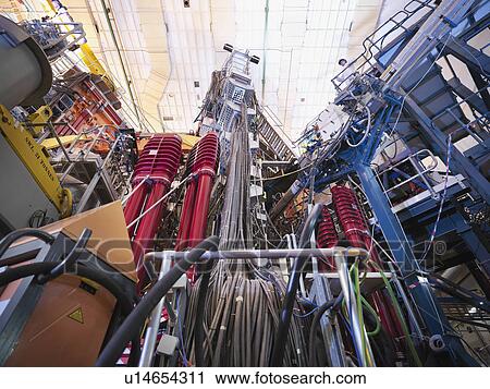 Stock Image - Scientist On Top Of Fusion Reactor. Fotosearch
