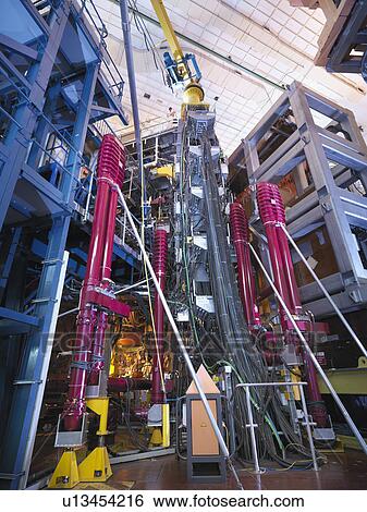 Stock Photograph - Scientist On Top Of Fusion Reactor. Fotosearch