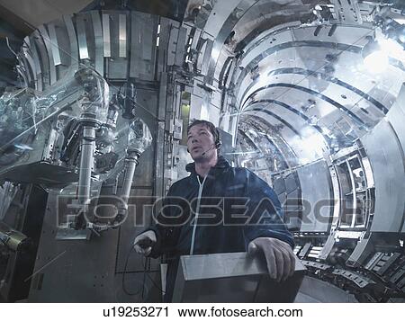 Scientist Working In A Fusion Reactor View Large Photo Image Stock Image - Scientist Working In A Fusion Reactor. Fotosearch