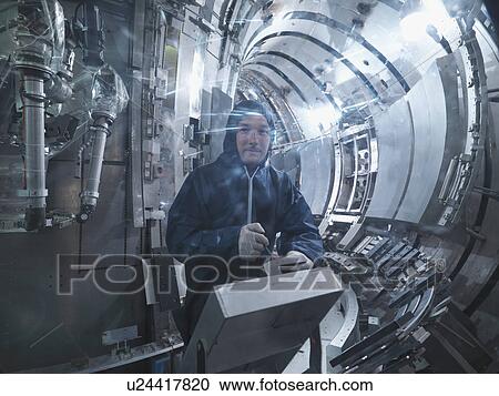 Scientist Working In A Fusion Reactor View Large Photo Image Stock Image - Scientist Working In A Fusion Reactor. Fotosearch