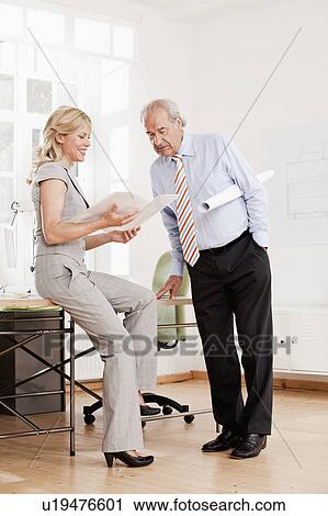 Stock Image - Senior businessman and business woman. Fotosearch
