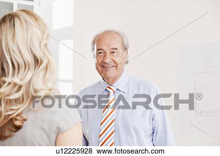Senior businessman and business woman View Large Photo Image Stock Photo - Senior businessman and business woman. Fotosearch