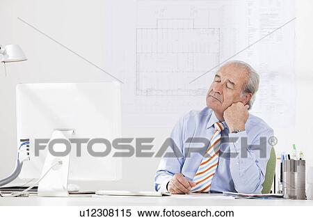 Stock Photography - Senior businessman daydreaming. Fotosearch