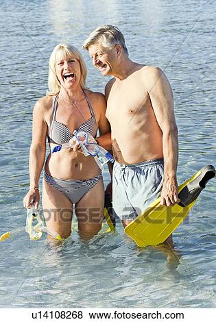 Senior couple with snorkels in the sea View Large Photo Image Stock Photo - Senior couple with snorkels in the sea. Fotosearch