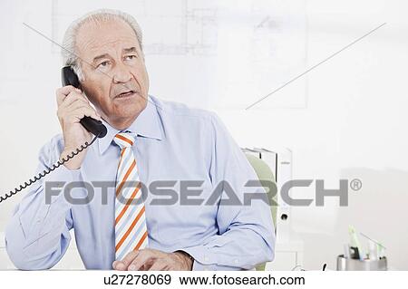 Stock Photo - Senior executive on the phone. Fotosearch