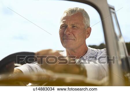 Senior man in sports car View Large Photo Image Picture - Senior man in sports car. Fotosearch