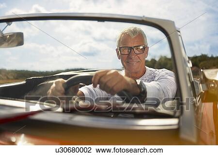 Senior man in sports car View Large Photo Image Stock Image - Senior man in sports car. Fotosearch