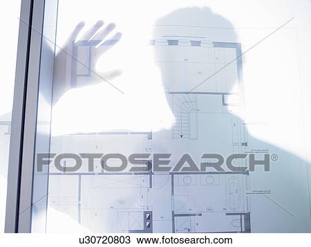 Silhouette of a man, blue prints in front View Large Photo Image Stock Image - Silhouette of a man, blue prints in front. Fotosearch