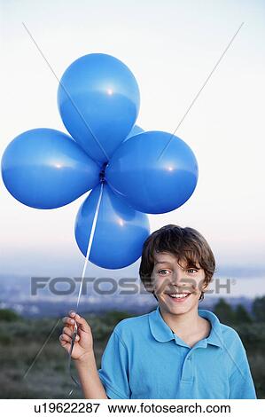 smiling boy with helium balloons View Large Photo Image Stock Photo - smiling boy with helium balloons. Fotosearch