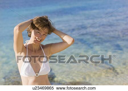Smiling woman in the sun View Large Photo Image Stock Photography - Smiling woman in the sun. Fotosearch