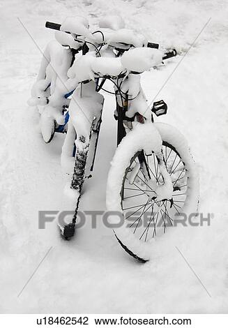 Snow covered bicycles View Large Photo Image Stock Image - Snow covered bicycles. Fotosearch
