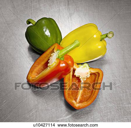 Some peppers on a steel surface View Large Photo Image Picture - Some peppers on a steel surface. Fotosearch